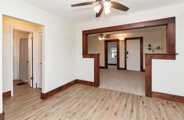 5812 SW 5th St, Des Moines, IA 50315 - spare room with a ceiling fan and light wood-style floors