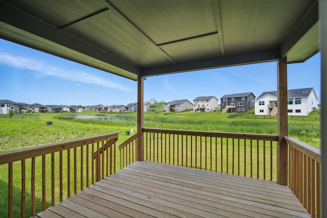 45 NW Alderleaf Dr, Waukee, IA 50263 - deck featuring a residential view, a lawn, and a water view