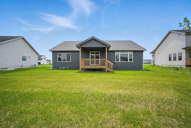 45 NW Alderleaf Dr, Waukee, IA 50263 - back of property featuring a yard and roof with shingles
