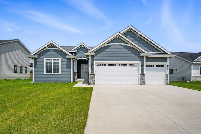 45 NW Alderleaf Dr, Waukee, IA 50263 - craftsman-style house with an attached garage, driveway, a front lawn, and stone siding