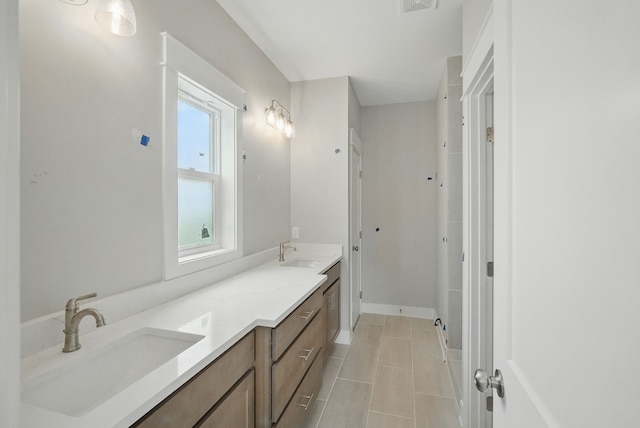 45 NW Alderleaf Dr, Waukee, IA 50263 - full bathroom featuring double vanity and tile patterned floors