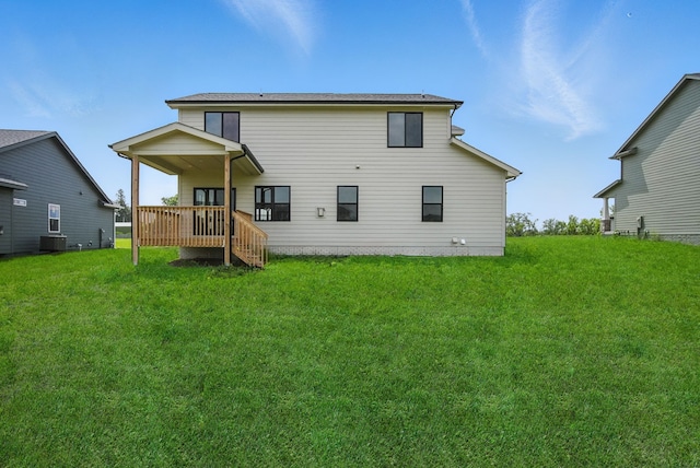 55 NW Alderleaf Dr, Waukee, IA 50263 - back of property with a lawn and a wooden deck
