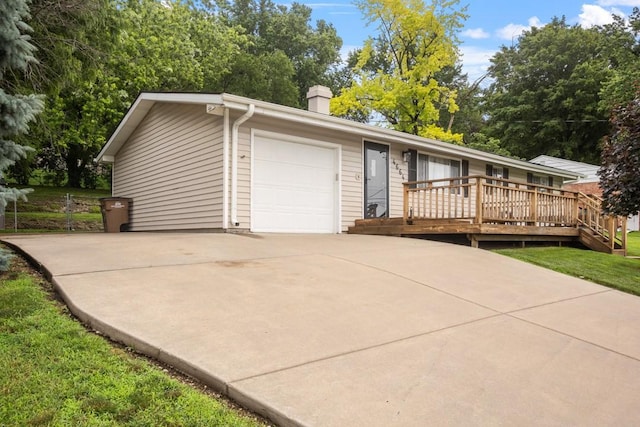4664 Parkridge Ave, Pleasant Hill, IA 50327 - ranch-style house with an attached garage, a chimney, concrete driveway, and a wooden deck