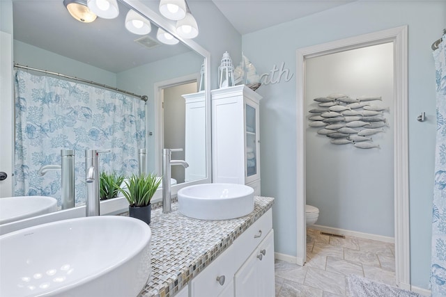 54 Four Winds Dr, Clear Lake, IA 50428 - full bathroom with double vanity and toilet