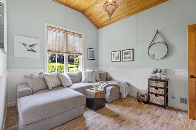 54 Four Winds Dr, Clear Lake, IA 50428 - living area featuring wood ceiling, wainscoting, lofted ceiling, and brick floors