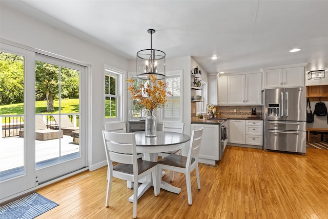 54 Four Winds Dr, Clear Lake, IA 50428 - dining room with light wood-style flooring and recessed lighting