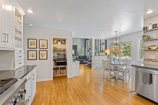 54 Four Winds Dr, Clear Lake, IA 50428 - kitchen featuring stainless steel appliances, open shelves, white cabinets, light wood finished floors, and recessed lighting