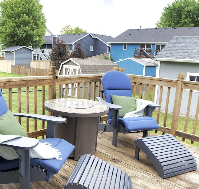 302 Crossing Ct NW, Bondurant, IA 50035 - deck featuring a storage unit, a residential view, and a fenced backyard