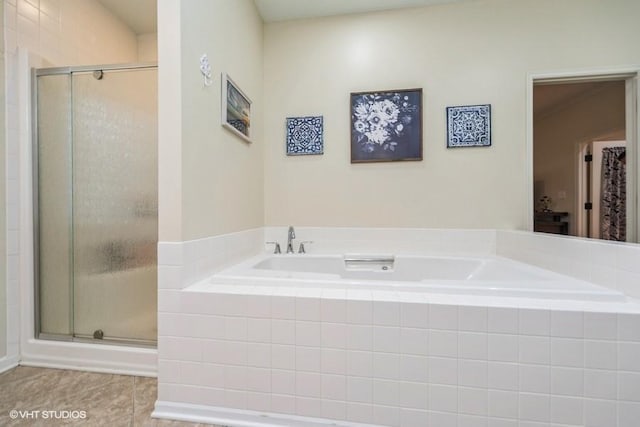 7100 Holcomb Ave, Urbandale, IA 50322 - full bathroom featuring tile patterned floors, a shower stall, and a bath