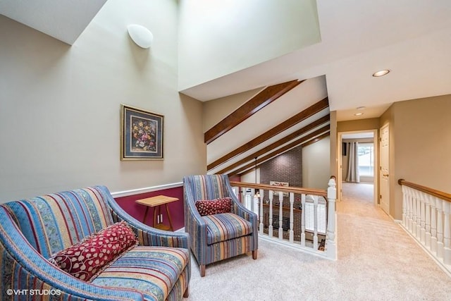 7100 Holcomb Ave, Urbandale, IA 50322 - living area with carpet flooring, an upstairs landing, recessed lighting, and vaulted ceiling