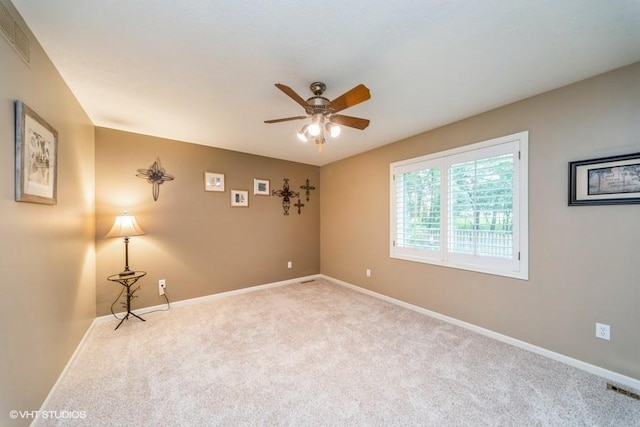 7100 Holcomb Ave, Urbandale, IA 50322 - empty room featuring a ceiling fan and carpet flooring