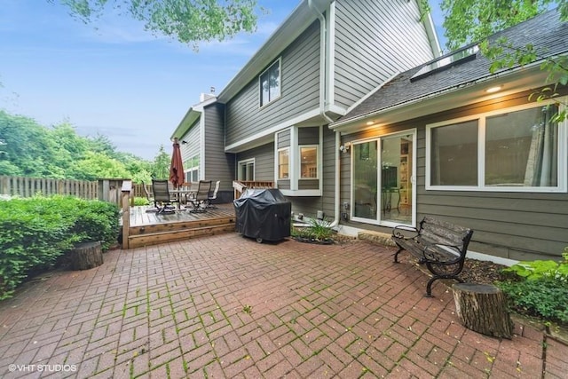 7100 Holcomb Ave, Urbandale, IA 50322 - view of patio / terrace with grilling area, a wooden deck, and outdoor dining area
