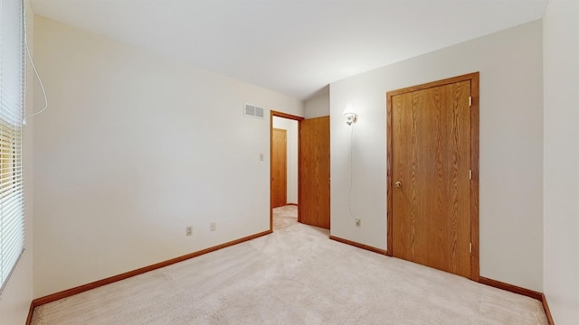 4610 SE 7th St, Des Moines, IA 50315 - unfurnished bedroom featuring carpet floors and a closet