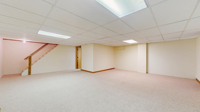 4610 SE 7th St, Des Moines, IA 50315 - finished below grade area featuring carpet, stairs, and a paneled ceiling