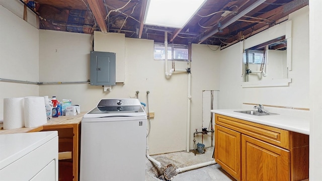 4610 SE 7th St, Des Moines, IA 50315 - washroom featuring electric panel, cabinet space, and washing machine and dryer