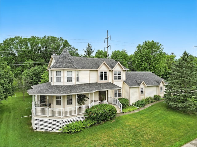 2400 Ridgetop Cir, Ames, IA 50014 - victorian home featuring covered porch, a front lawn, and roof with shingles