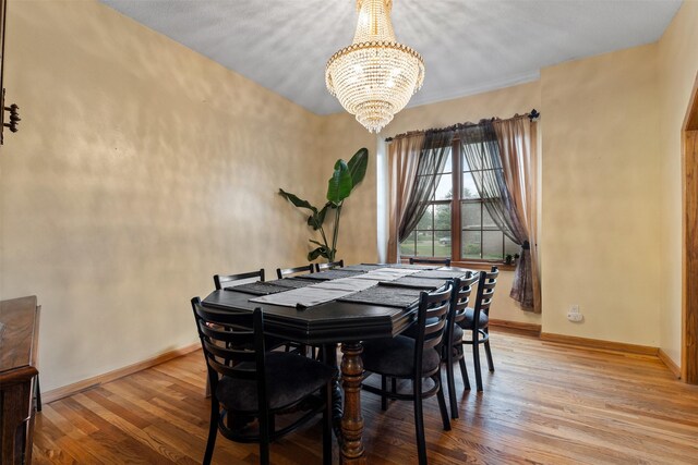 2400 Ridgetop Cir, Ames, IA 50014 - dining room featuring a chandelier and wood finished floors