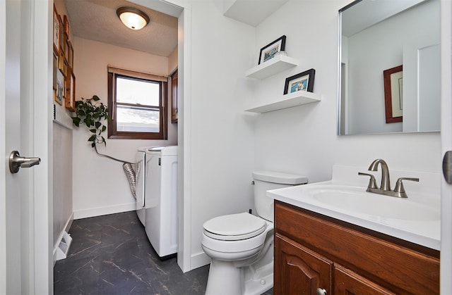 5208 Pommel Pl, West Des Moines, IA 50265 - bathroom with washer and clothes dryer, vanity, and marble finish flooring