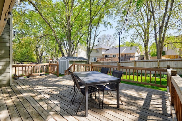 5208 Pommel Pl, West Des Moines, IA 50265 - wooden deck with a storage unit, outdoor dining space, a fenced backyard, and a residential view