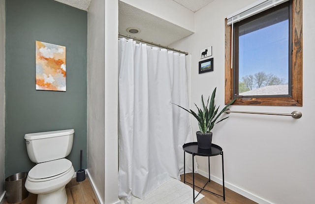5208 Pommel Pl, West Des Moines, IA 50265 - bathroom with wood finished floors, a textured ceiling, and curtained shower
