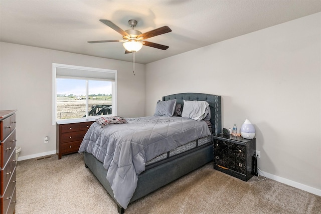 1115 Locust St, Waukee, IA 50263 - bedroom featuring light carpet and a ceiling fan