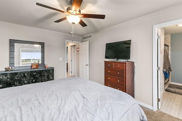1115 Locust St, Waukee, IA 50263 - bedroom featuring baseboards and ceiling fan