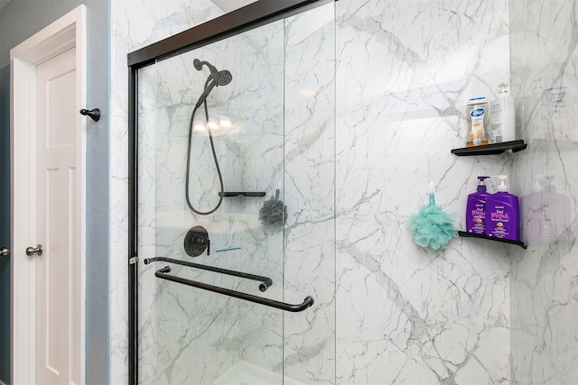 1115 Locust St, Waukee, IA 50263 - bathroom featuring a marble finish shower