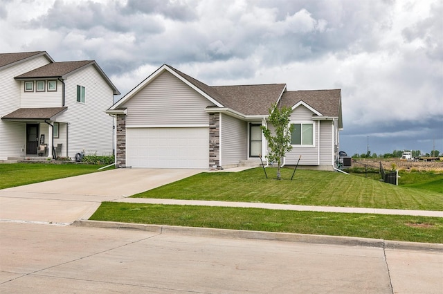 1115 Locust St, Waukee, IA 50263 - view of front of house with driveway, an attached garage, and roof with shingles