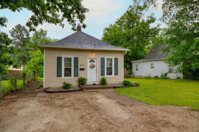 951 28th St, Des Moines, IA 50312 - view of front facade with a chimney and roof with shingles