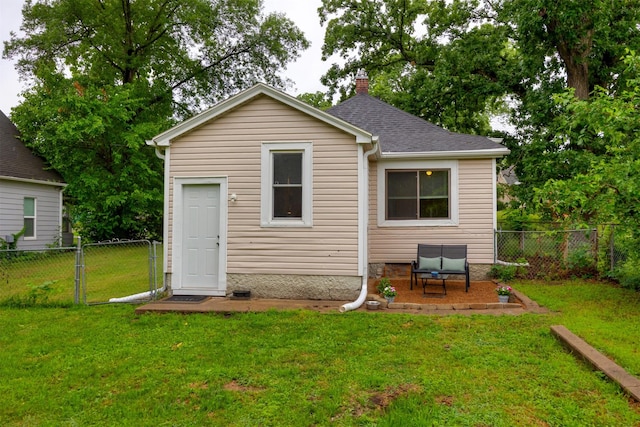 951 28th St, Des Moines, IA 50312 - rear view of property with a fenced backyard and a chimney