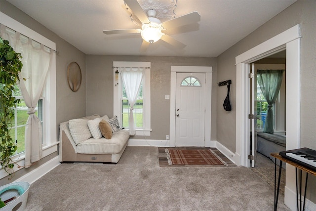 951 28th St, Des Moines, IA 50312 - entryway with carpet flooring and a ceiling fan