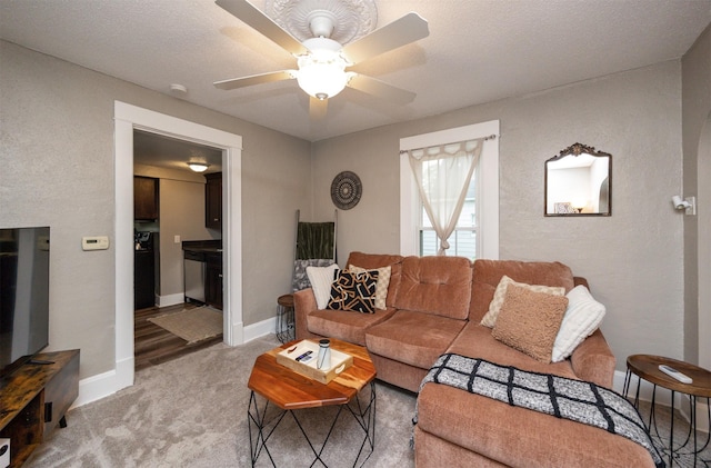 951 28th St, Des Moines, IA 50312 - living room with a ceiling fan and light colored carpet