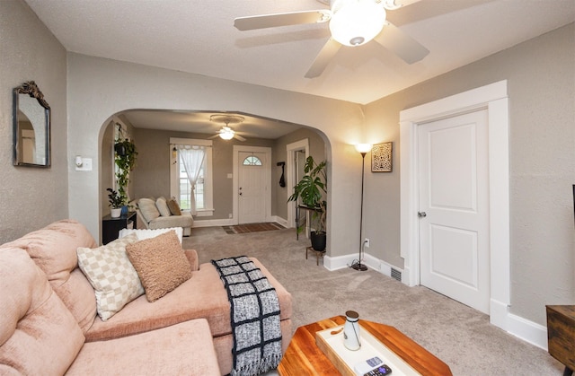 951 28th St, Des Moines, IA 50312 - carpeted living area featuring arched walkways and ceiling fan