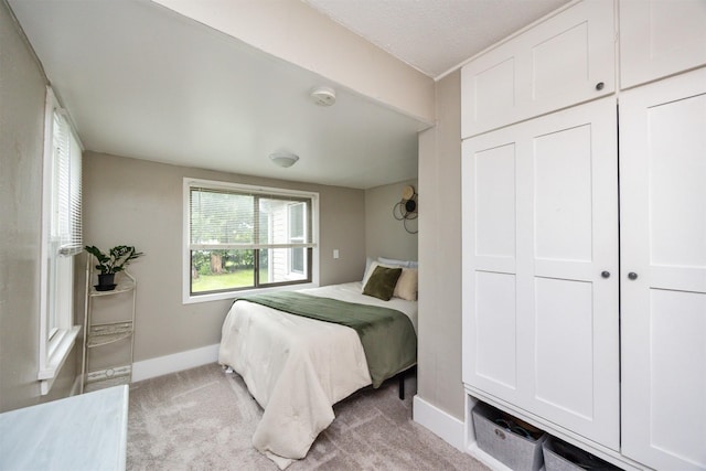 951 28th St, Des Moines, IA 50312 - bedroom featuring baseboards and light colored carpet