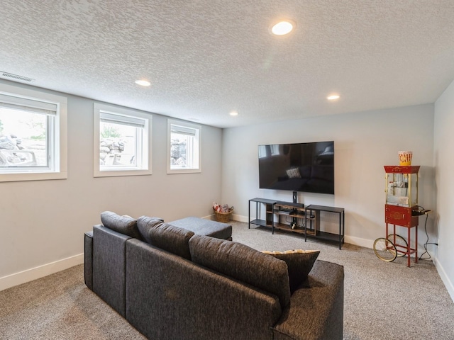 15815 Winston Ave, Urbandale, IA 50323 - carpeted living area with plenty of natural light, recessed lighting, and a textured ceiling
