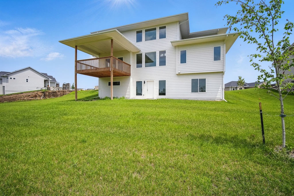 1310 NW Alderleaf Dr, Waukee, IA 50263 - back of house with a lawn