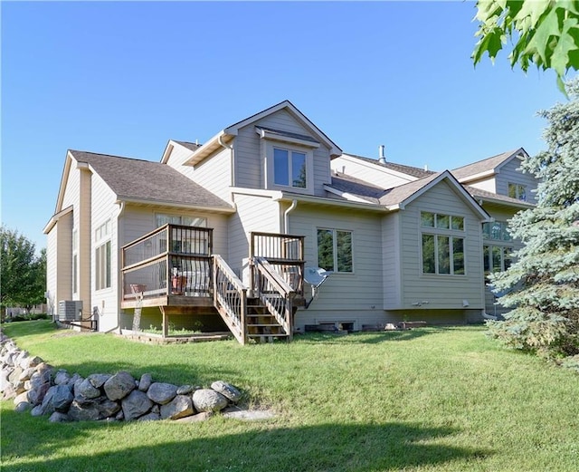 1699 Glade Dr SW, Altoona, IA 50009 - rear view of house featuring a wooden deck, a yard, and stairway