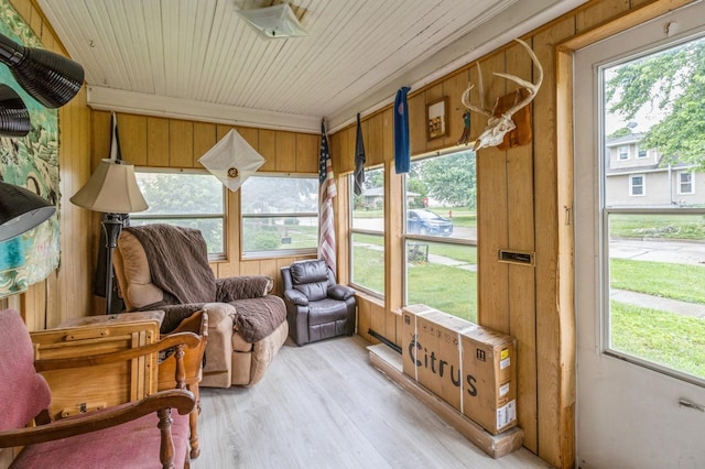105 N St, Guthrie Center, IA 50115 - sunroom featuring healthy amount of natural light, wood ceiling, wood finished floors, and wood walls