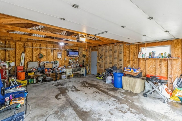 105 N St, Guthrie Center, IA 50115 - garage featuring a workshop area