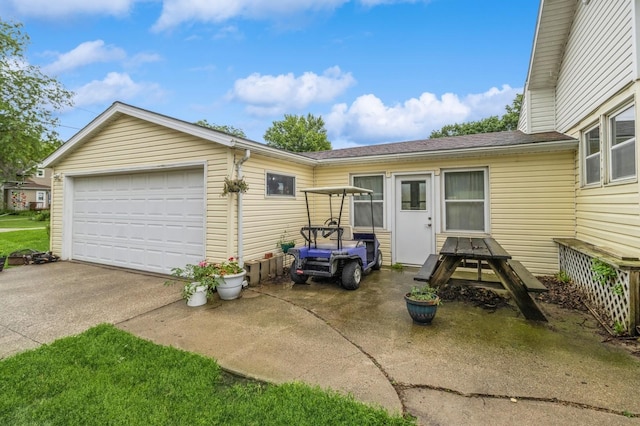 105 N St, Guthrie Center, IA 50115 - view of front of home featuring a garage and a shingled roof