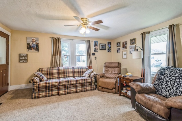 105 N St, Guthrie Center, IA 50115 - carpeted living room featuring ceiling fan