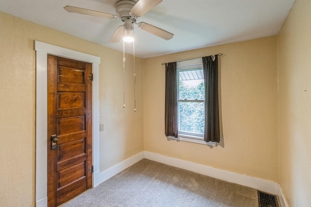 105 N St, Guthrie Center, IA 50115 - carpeted empty room with baseboards and a ceiling fan
