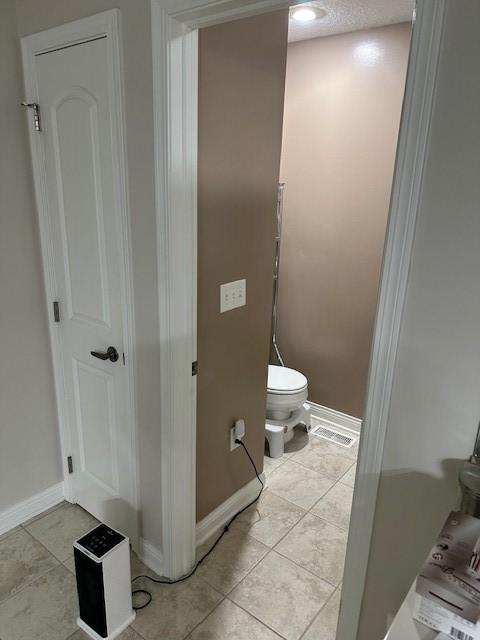 4017 160th St, Urbandale, IA 50323 - bathroom with toilet and tile patterned floors