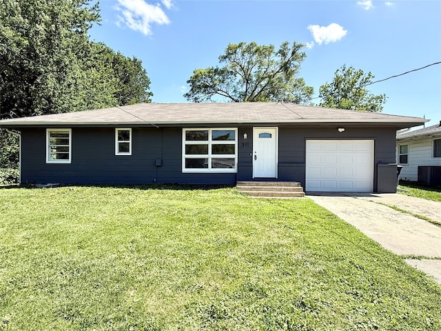 211 E Leach Ave, Des Moines, IA 50315 - ranch-style home with driveway, a front lawn, and a garage