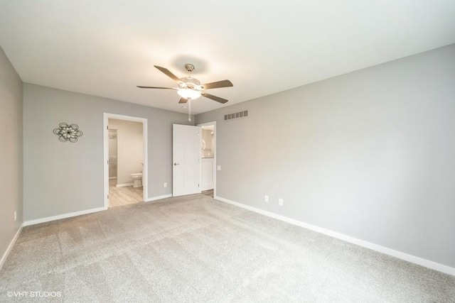 112 Hickory Way, Polk City, IA 50226 - unfurnished bedroom with light colored carpet, ensuite bathroom, and a ceiling fan