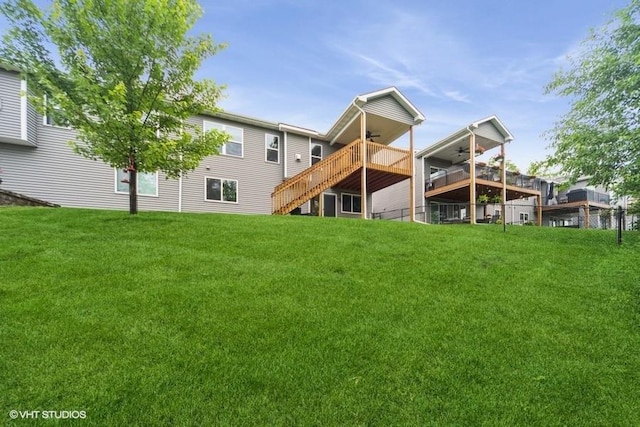 112 Hickory Way, Polk City, IA 50226 - back of house with a ceiling fan, stairway, a lawn, and a wooden deck