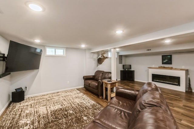 310 SE 3rd St, Panora, IA 50216 - living area with wood finished floors, recessed lighting, and a glass covered fireplace