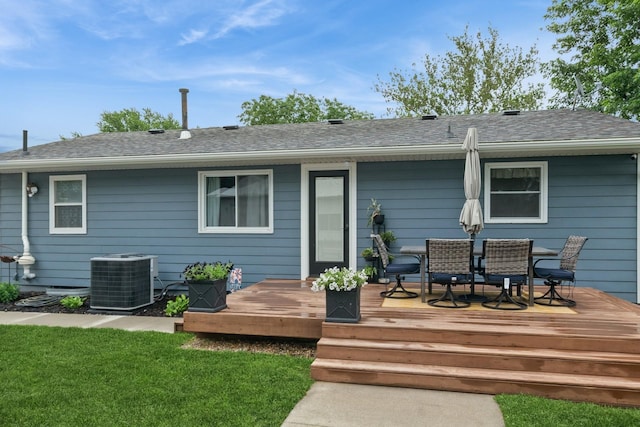 310 SE 3rd St, Panora, IA 50216 - rear view of property with a deck, outdoor dining area, a yard, and a shingled roof