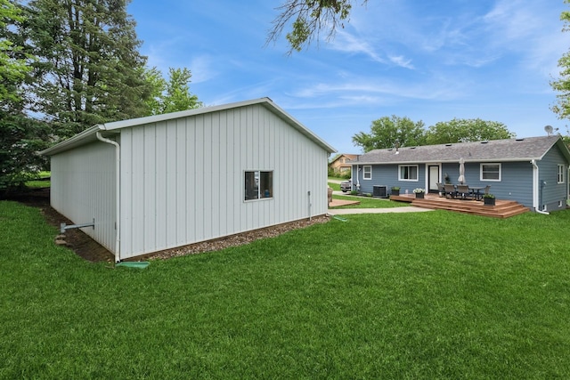 310 SE 3rd St, Panora, IA 50216 - rear view of house with a deck and a yard
