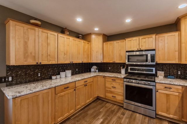 310 SE 3rd St, Panora, IA 50216 - kitchen with stainless steel appliances, light brown cabinets, decorative backsplash, dark wood-style flooring, and recessed lighting
